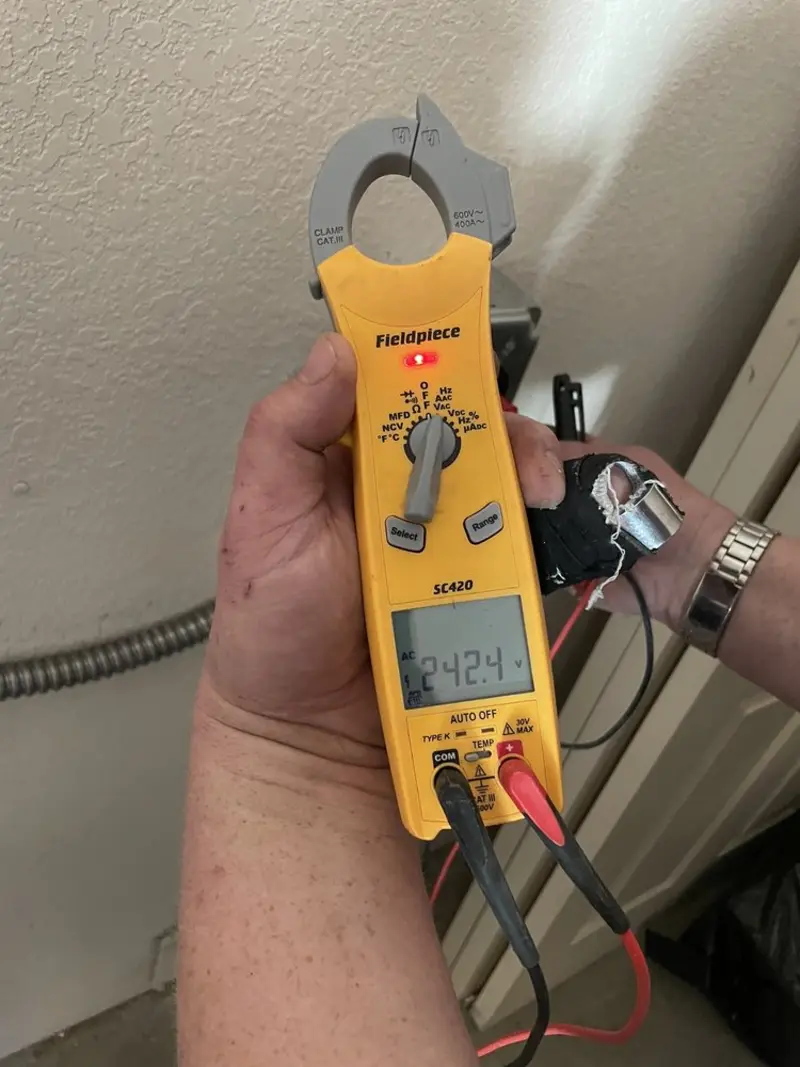 Voltage testing with clamp meter during Ceiling Fan Installation in Sherman